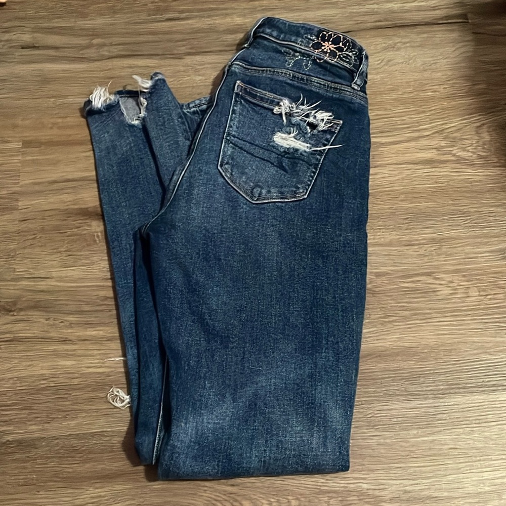 embroidered distressed jeans